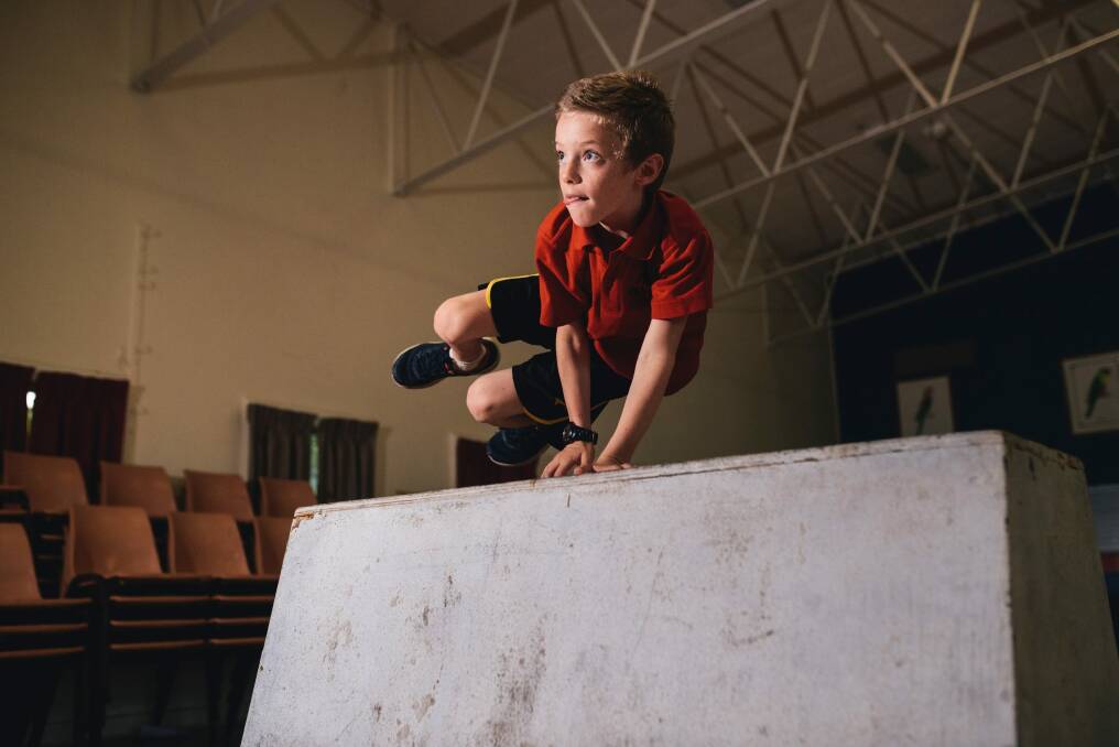 High-flyer: North Ainslie pupil Gus Warfield, 9, learns the art of parkour at school. Photo: Rohan Thomson