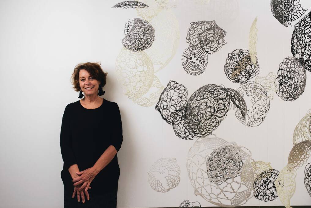 Canberra Glassworks curator Jane Cush with Naire Orthu by Ursula Halpin. Photo: Rohan Thomson