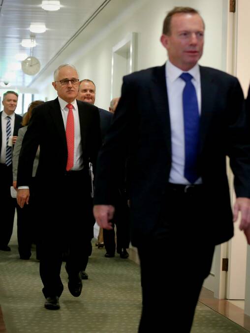 Former prime minister Tony Abbott (right) told the meeting that the poor result in NSW emphasised the need for great reform. Photo: Alex Ellinghausen