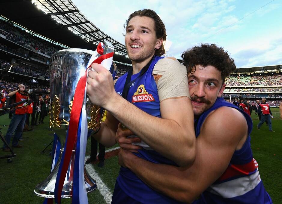 Bontempelli and Tom Liberatore hold tight to that premiership feeling. Photo: Getty Images