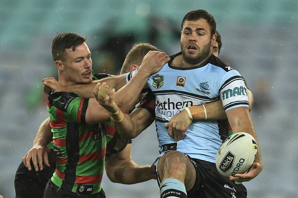 Looking for support: Wade Graham tries to offload during the round 24 NRL match between the South Sydney Rabbitohs and the Cronulla Sharks at ANZ Stadium. Photo: Brett Hemmings