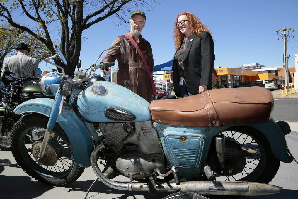 Don Thomas, of Gunning, checks out a 1959 Russian Izh motorcycle belonging to Heidi Pritchard, of Fraser.
 Photo: Jeffrey Chan.