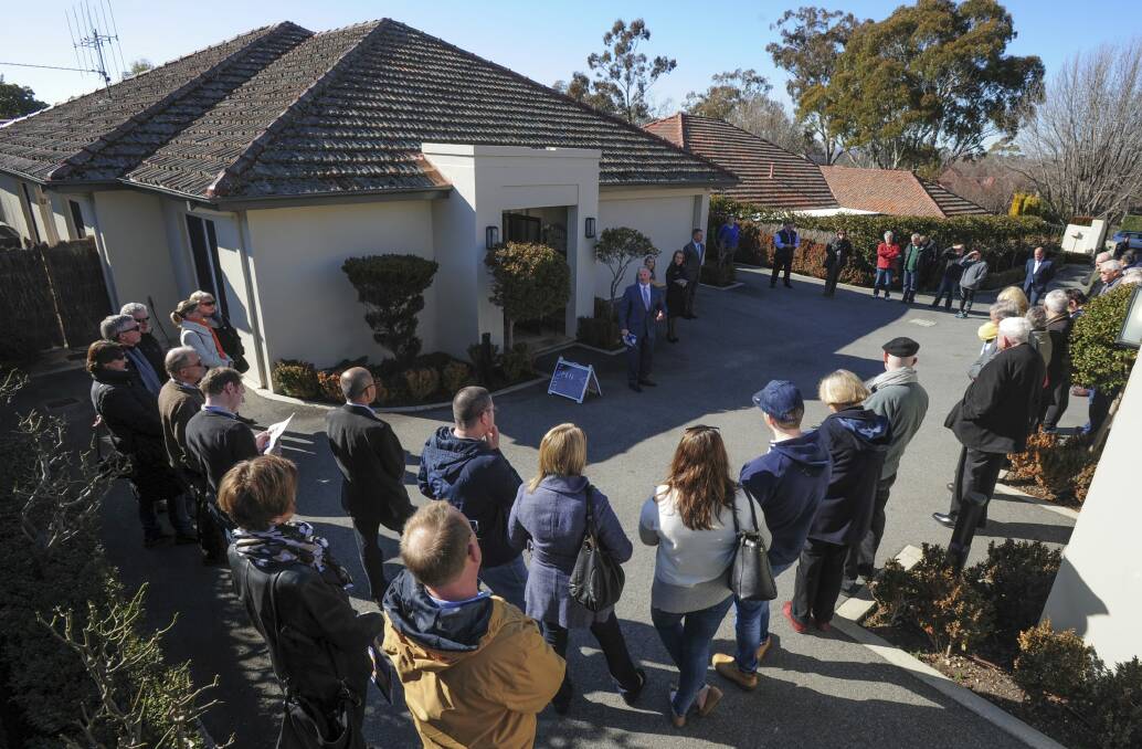 Housing values are sluggish in Canberra but auctions make up a large portion of sales in Australia. Photo: Graham Tidy