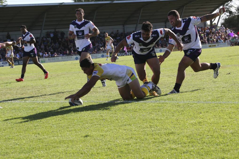 Jeremy Hawkins scores the first of his two tries against the Storm. Photo: Area News