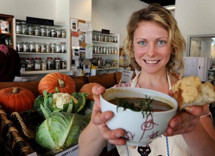 Sarah Norgrove from the ANU Food Co-op with her sweet-potato,sunflower seed, leek and roasted sweet-corn soup. Photo: Colleen Petch