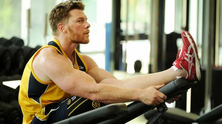 Brumbies winger Clyde Rathbone works out in the gym. Photo: Colleen Petch