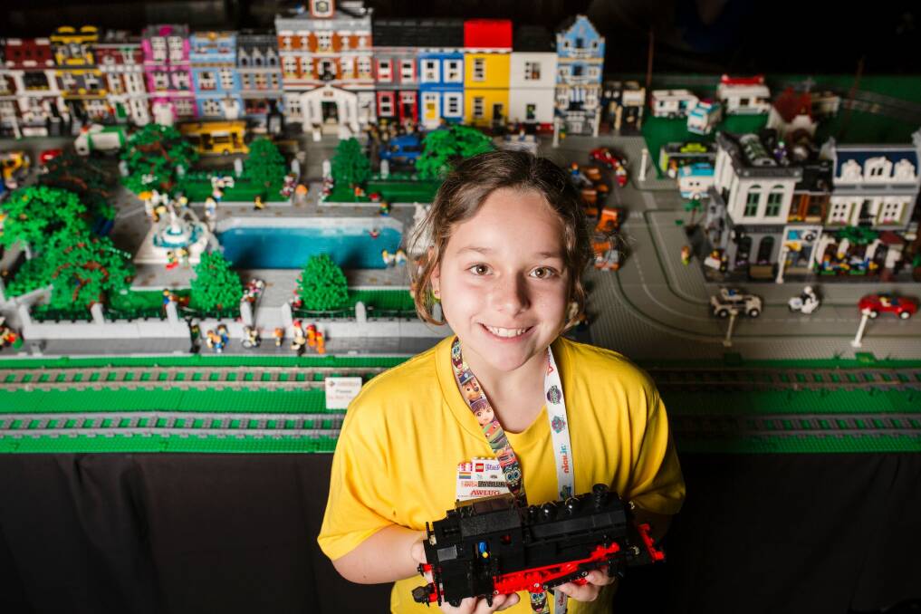 The Canberra Brick Expo is an annual event held at Canberra that exhibits LEGO creations from builders from all over Australia. Nine-year-old Celeste Dakos of Albury got the first peek on Friday. Photo: Jamila Toderas