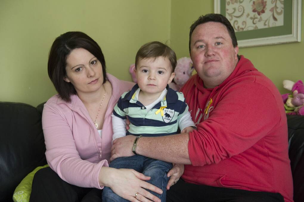 Troy and Lauren McGuigan, with their son Max, will pay tribute to their daughter Annie McGuigan, who died of brain cancer last month aged four. Photo: Jay Cronan