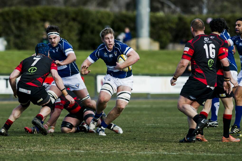 Royals' Tom Staniforth looks for a gap in Gungahlin's defence. Photo: Jamila Toderas