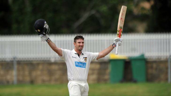 Ton of fun: Shaun Marsh celebrates his century against NSW at Manuka Oval. Photo: Graham Tidy