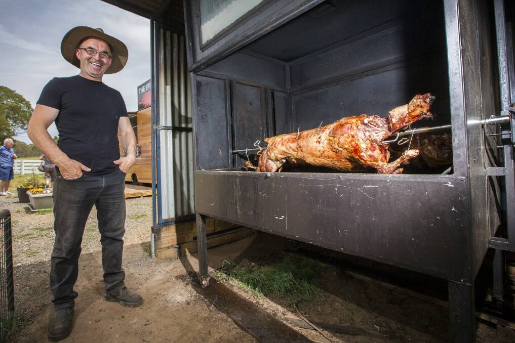 Robert Azbajic is attracting crowds of hungry travellers with his spit roast pig and lamb kebabs. Photo: Matt Bedford