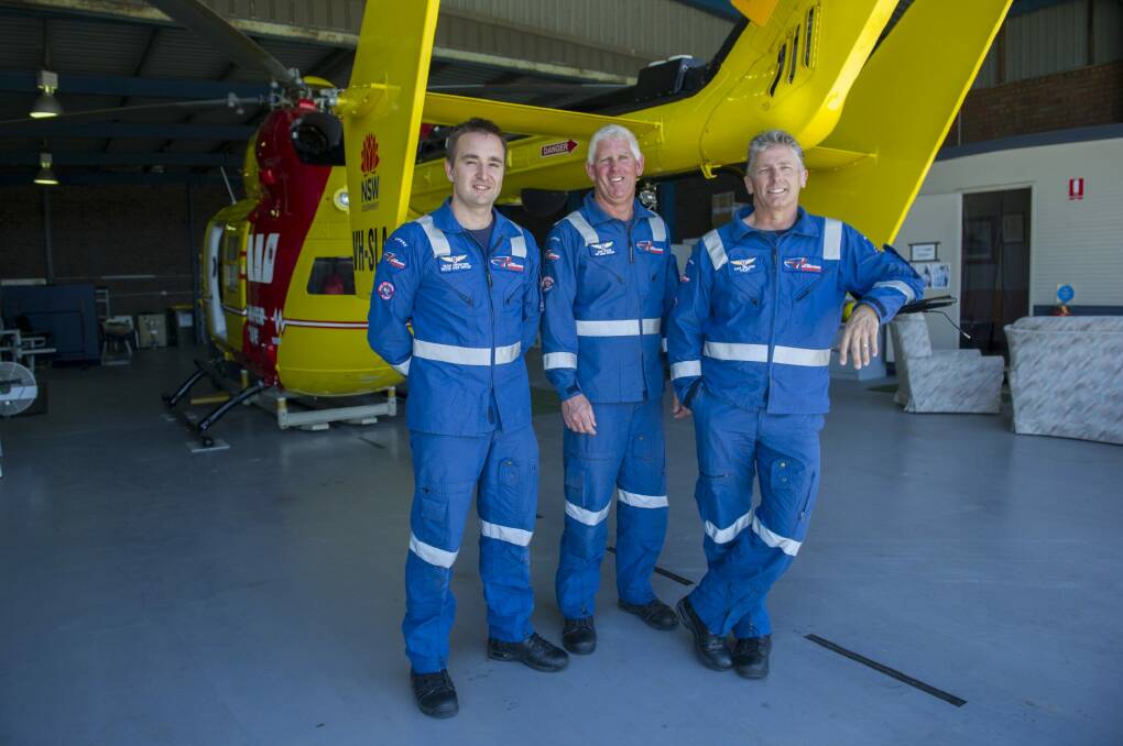 Westpac Life Saver Rescue Helicopter crew members Sean Orsborn, John Costin and pilot Sam Wilson will be part of boosted patrols at South Coast beaches over summer. Photo: Jay Cronan