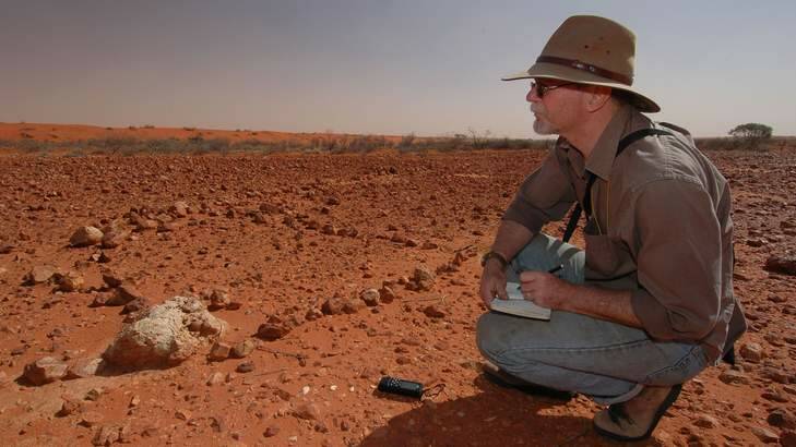 Mike Smith at work in the Simpson Desert. Photo: Stuart Grant