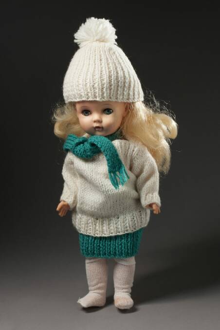 Doll and knitted dolls' clothes belonging to Rosie Batty. Photo: George Serras, National Museum of Australia.