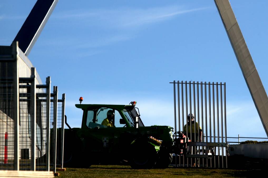 Workers installed the first section of a 2.6m high security fence at Parliament House. Photo: Andrew Meares