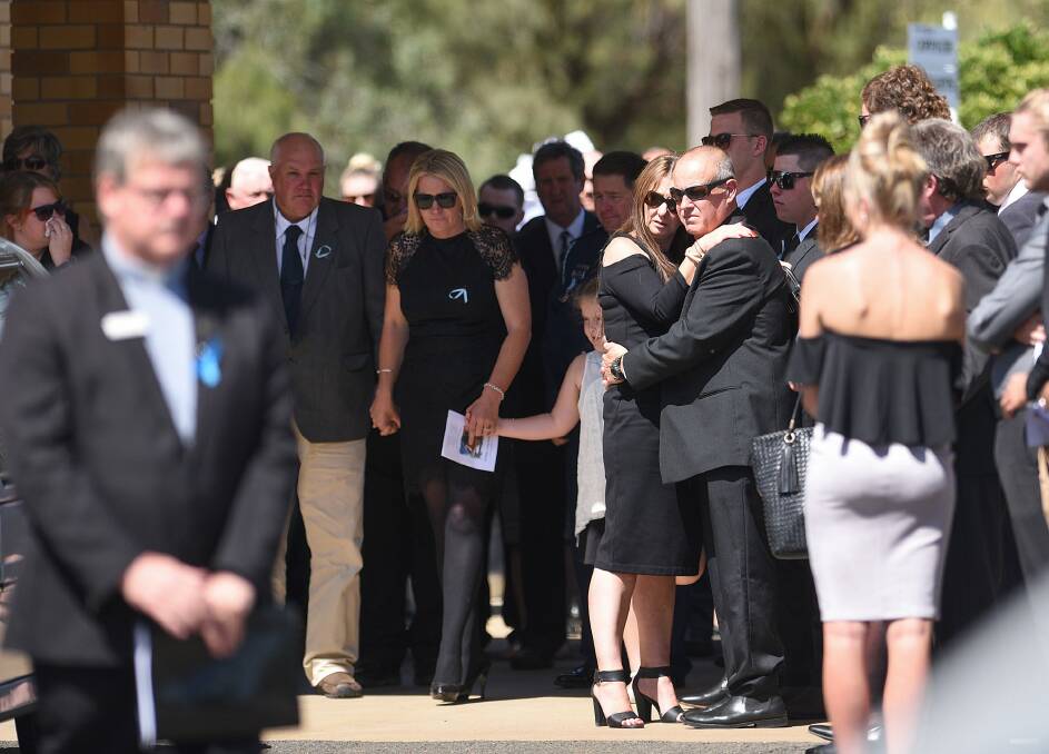 LOVING FAMILY: Jane and Ian Thomson support each other, with daughter Bessie and sons Colin and Braden behind, as more than 150 people gathered to pay their respects to their eldest child Riharna.  Photo: Gareth Gardner