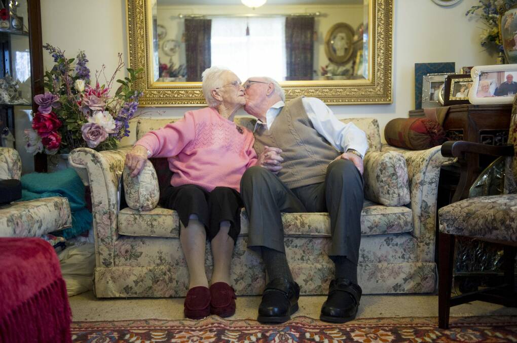 Doreen and Sam Flanigan share a tender 70th wedding anniversary moment.  Photo: Jay Cronan