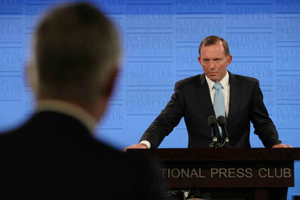 Prime Minister Tony Abbott takes a question from Channel 7's Mark Riley as he addresses the National Press Club. Photo: Alex Ellinghausen