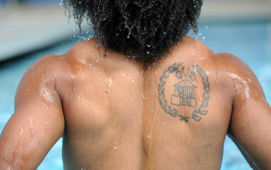 Henry Speight has a tattoo of his school on his shoulder. Photo: Graham Tidy