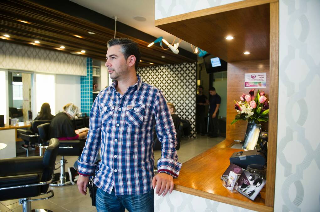 Ora Hair owner Marco Imbriano, in the Cosmopolitan Building, said he had to let one apprentice go last year due to lack of work.   
30 April 2015
Photo: Rohan Thomson
The Canberra Times Photo: Rohan Thomson