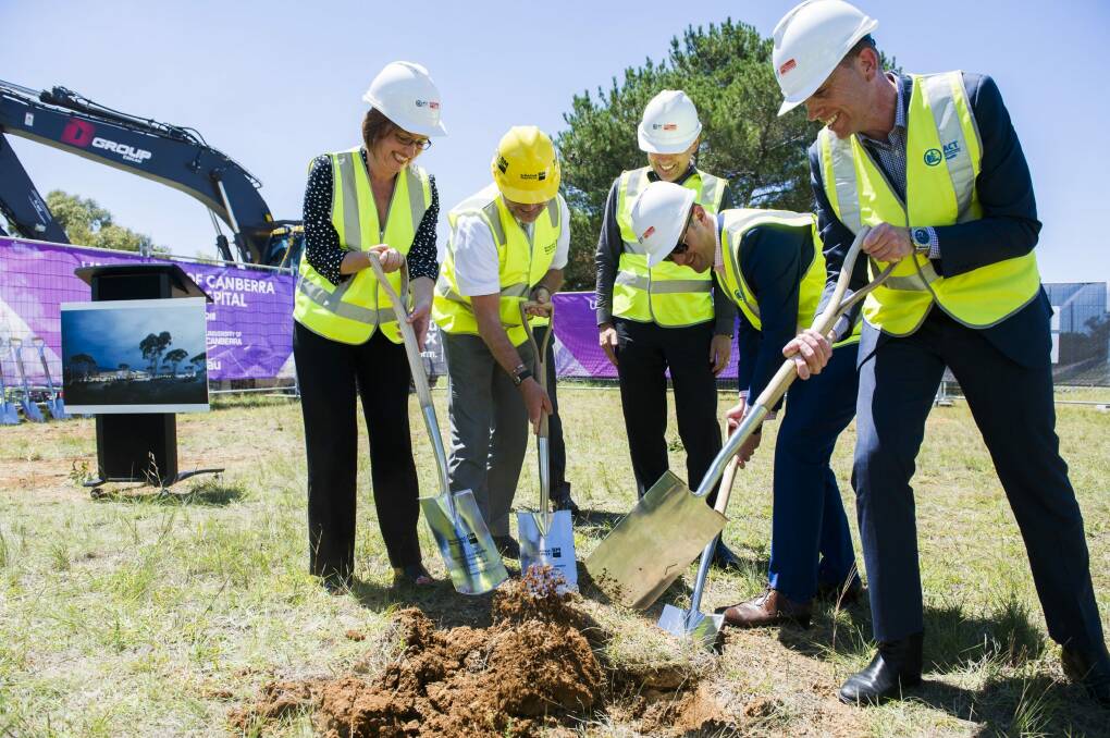 Meegan Fitzharris, left, Stephen Parker, Chris Burke, Andrew Barr, and Simon Corbell at the sod-turning event at the University of Canberra public hospital site. Photo: Rohan Thomson