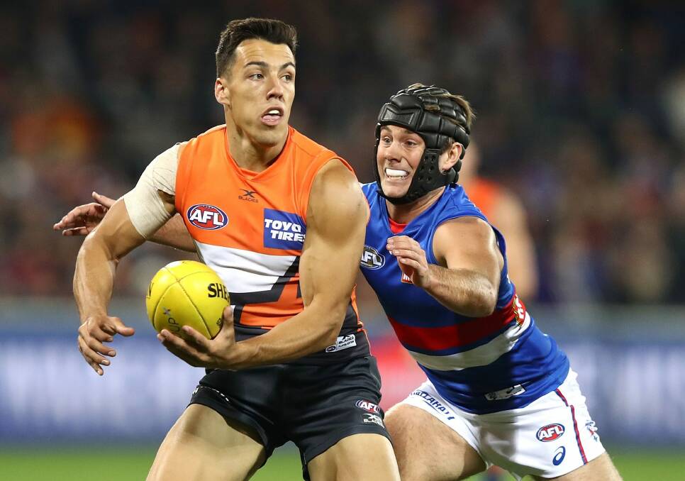 CANBERRA, AUSTRALIA - APRIL 28: Dylan Shiel of the Giants is tackled by Caleb Daniel of the Bulldogs during the round six AFL match between the Greater Western Sydney Giants and the Western Bulldogs at UNSW Canberra Oval on April 28, 2017 in Canberra, Australia. (Photo by Ryan Pierse/Getty Images) Photo: Ryan Pierse