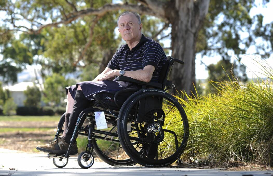 Quadraplegic Lud Kerec says Canberra airport's open-air  scissor-lift style device makes him feel unsafe. Photo: Graham Tidy