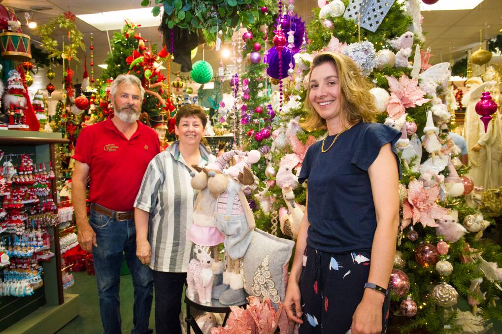 Christmas Barn owners Neville and Leanne de Smet with daughter Carly, who is also part of the business. Photo: Elesa Kurtz