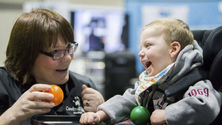 Julia Teale and Lucas Wallace, 2, at the  Early Intervention and Therapy Services Expo. Photo: Matt Bedford