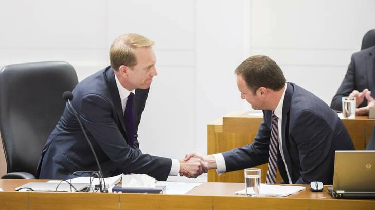 Simon Corbell shakes hands with Andrew Barr after introducing the Marriage Equality Bill in the ACT Legislative of Assembly. Photo: rohan.thomson.canberratimes@gmai