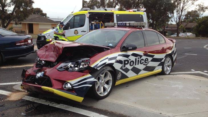 A police patrol car was extensively damaged in a crash in Belconnen this morning. Photo: Supplied / ACT Policing