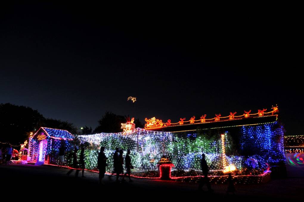 Master at work: Phil Jensen's home in Bissenberger Crescent, Kambah, is a symphony of Christmas lights. Photo: Marina Neil
