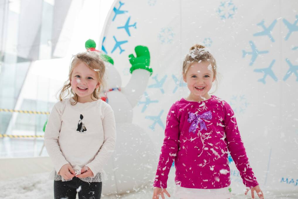 Friends, Amelia Bullock and Alexandra Bradford, both aged four, inside the snow globe. Photo: Jamila Toderas