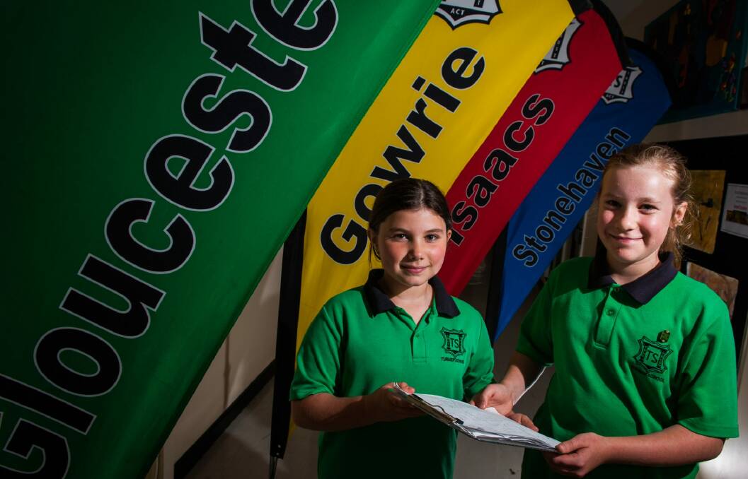 Turner School sisters Ellie Archer nine, and Ruby Archer, 11, are campaigning to have one of their school's sporting houses named after a female and have started a petition to gain support. Photo: Elesa Kurtz