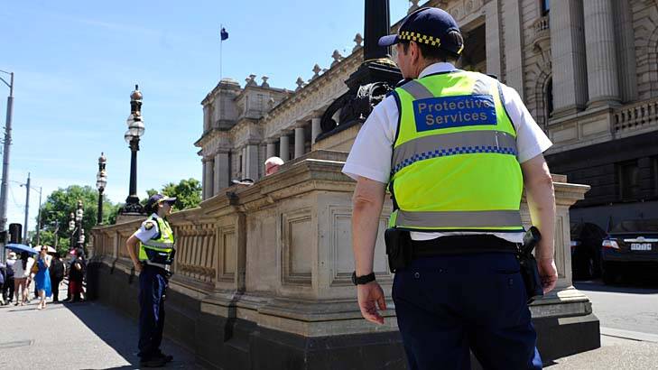 Protective services officers outside Parliament House. Photo: Justin McManus