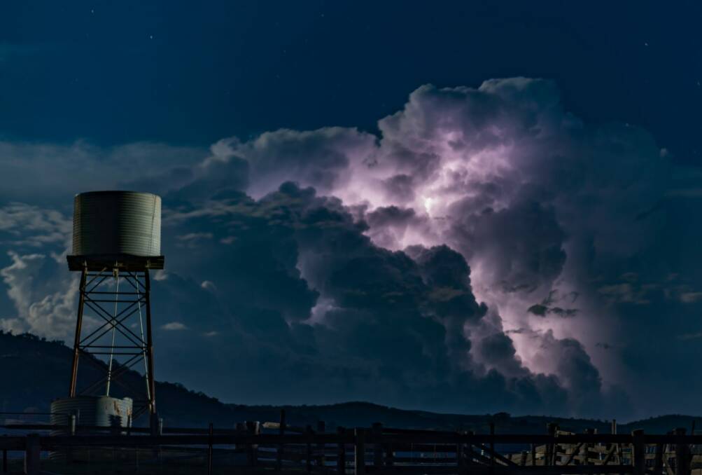 Canberra photographer, Ian Williams from Calwell, captured Tuesday's storm, lit up by a supermoon. Photo: Ian Williams