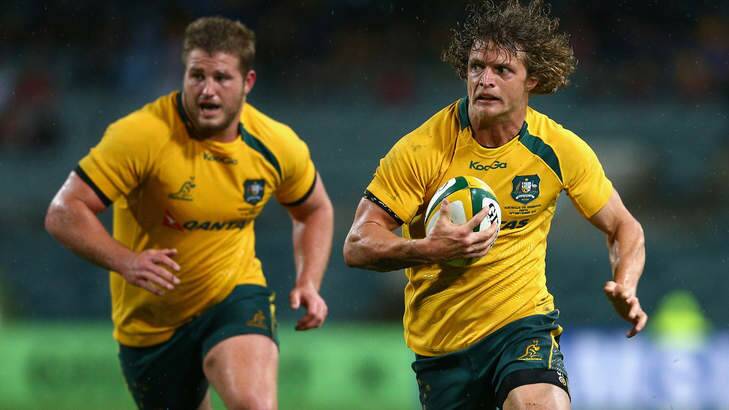 WIld honey badger: Nick Cummins on the move. Photo: Getty Images