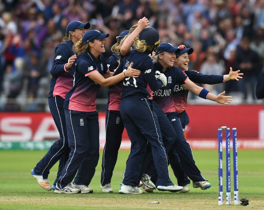 The England team celebrates after taking India's final wicket on Sunday. Photo: Getty Images