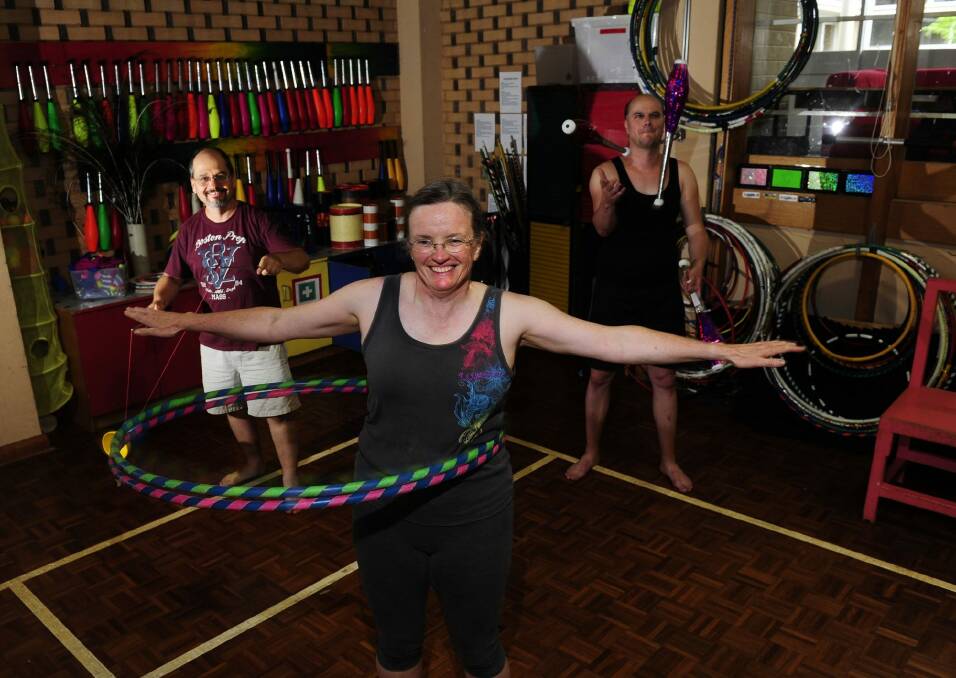 From left, John Lloyd, of Aranda, Mary Kershaw, of Fraser, and Sara Robinson, of Holder, at a Warehouse Circus adult class in Chifley. Photo: Melissa Adams 
