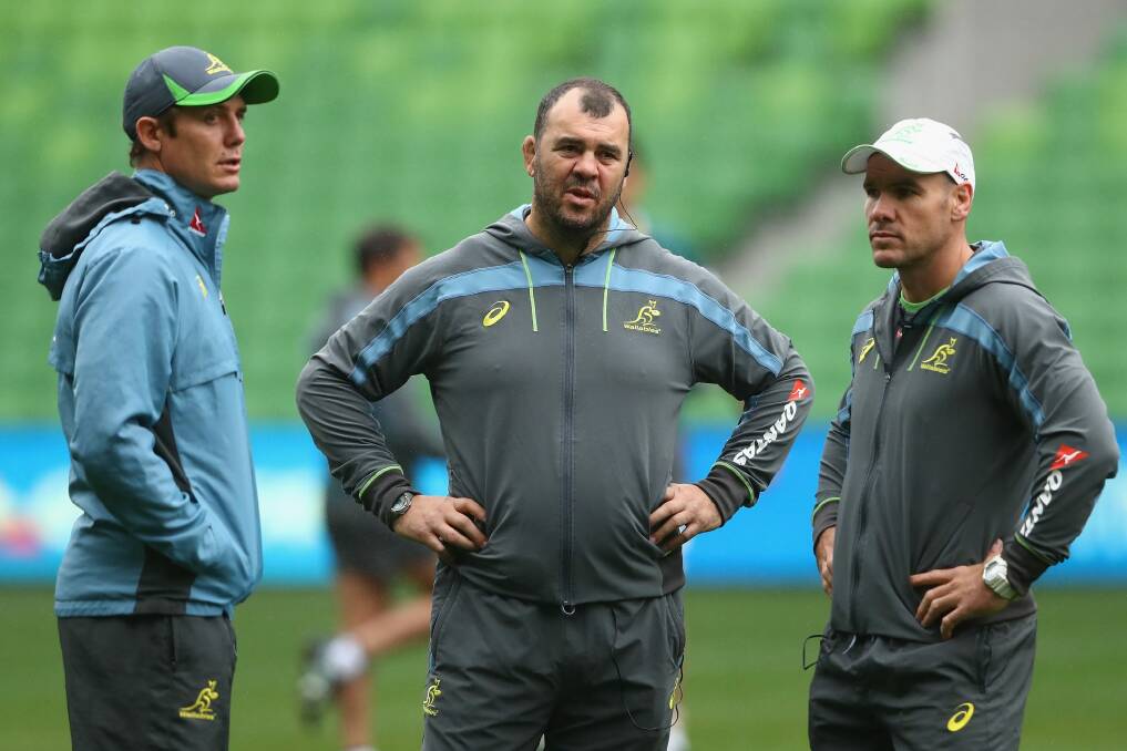 Wallabies coach Michael Cheika with assistants Stephen Larkham and Nathan Grey. Photo: Getty Images