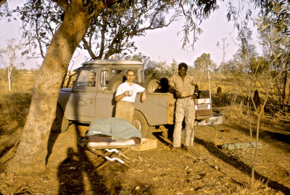 Dr Bob Kirk with an unknown man at Pineapple Bore, Kimberley, WA, in 1960 during the collection of blood samples. Photo: Supplied
