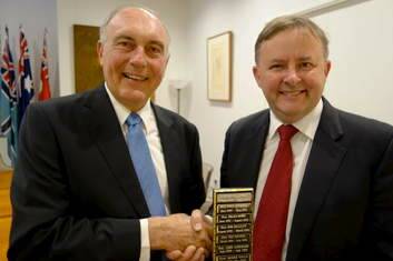 Former deputy PM Anthony Albanese passed on the trophy to new deputy PM Warren Truss in the DPM?s suits at Parliament House this week.