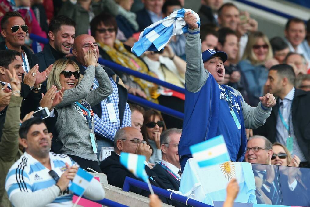 Support:  Diego Maradona celebrates in the stands at the rugby World Cup. Photo: Getty Images