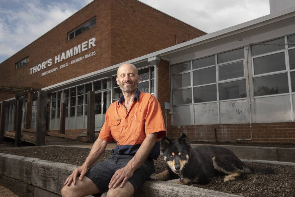 Thor Diesendorf and his dog Ziggy outside his new business premises at the former Tip Top factory.  Photo: Sitthixay Ditthavong