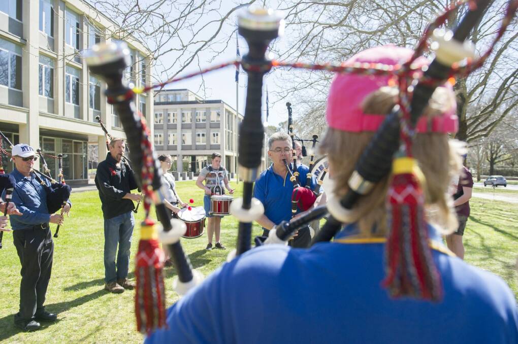 Canberra Burns Club members practise for the annual  gathering and pipe band competition.  Photo: Jay Cronan