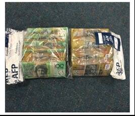 Wads of cash were seized during two drug raids in Canberra on Thursday. Photo: ACT Policing
