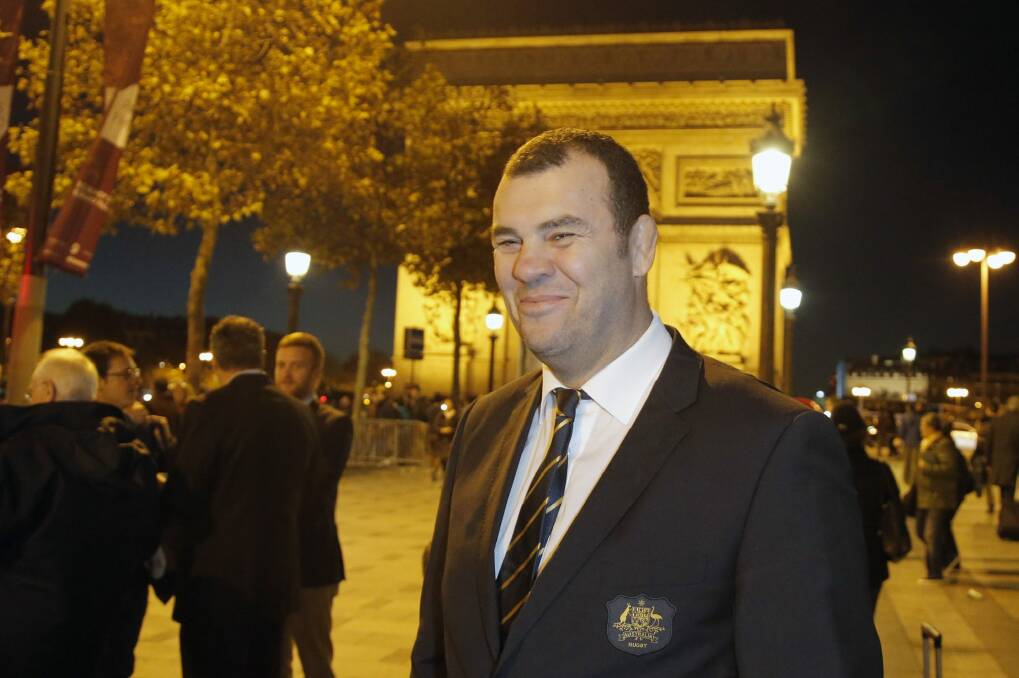Warm welcome: Michael Cheika, pictured in front of the Arc de Triomphe this week. Photo: AP