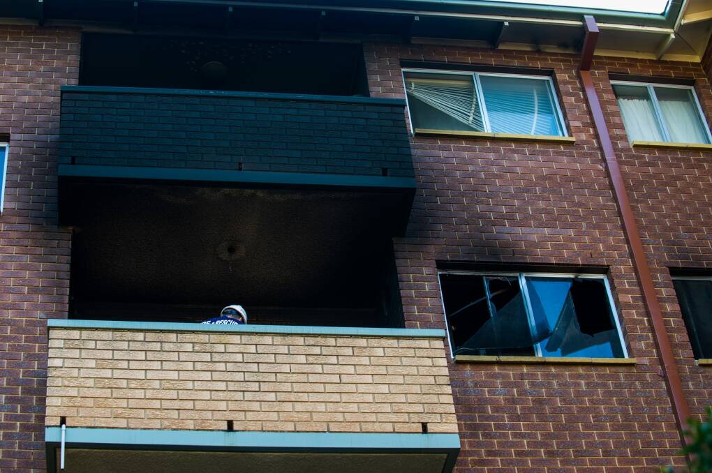 Police combing the Queanbeyan unit where a baby girl died on Tuesday. Photo: Elesa Kurtz