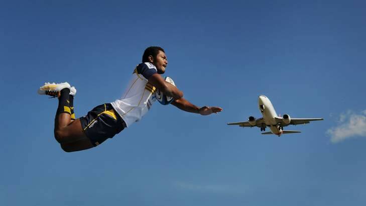 Brumbies winger Henry Speight takes flight at Canberra Airport on Thursday (and yes, this photo is real). Photo: Colleen Petch