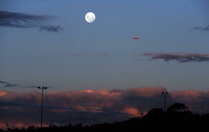 The moon rising over Canberra last night. Photo: Graham Tidy